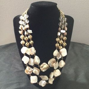 Chunky gold multi-strand shell necklace-costume jewelry